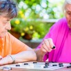 Two-senior-ladies-playing-board-game-in-rest-home-1024x683.jpg