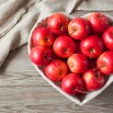 2017Food___Berries_and_fruits_and_nuts_Beautiful_red_apples_in_a_plate_in_the_shape_of_a_heart_on_a_table_118766_.jpg